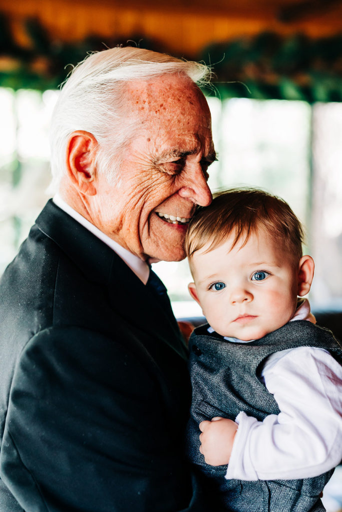 The Gold Mountain Manor In Big Bear, CA wedding photography; an old man with a cute little baby