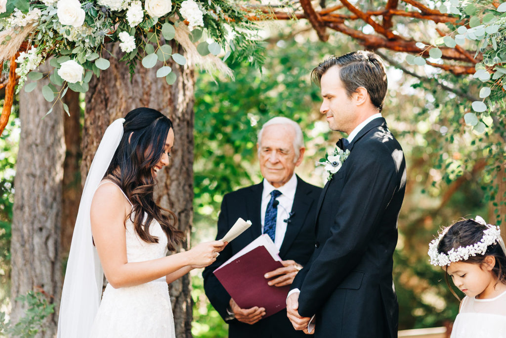 The Gold Mountain Manor In Big Bear, CA wedding photography; bride reading the vows