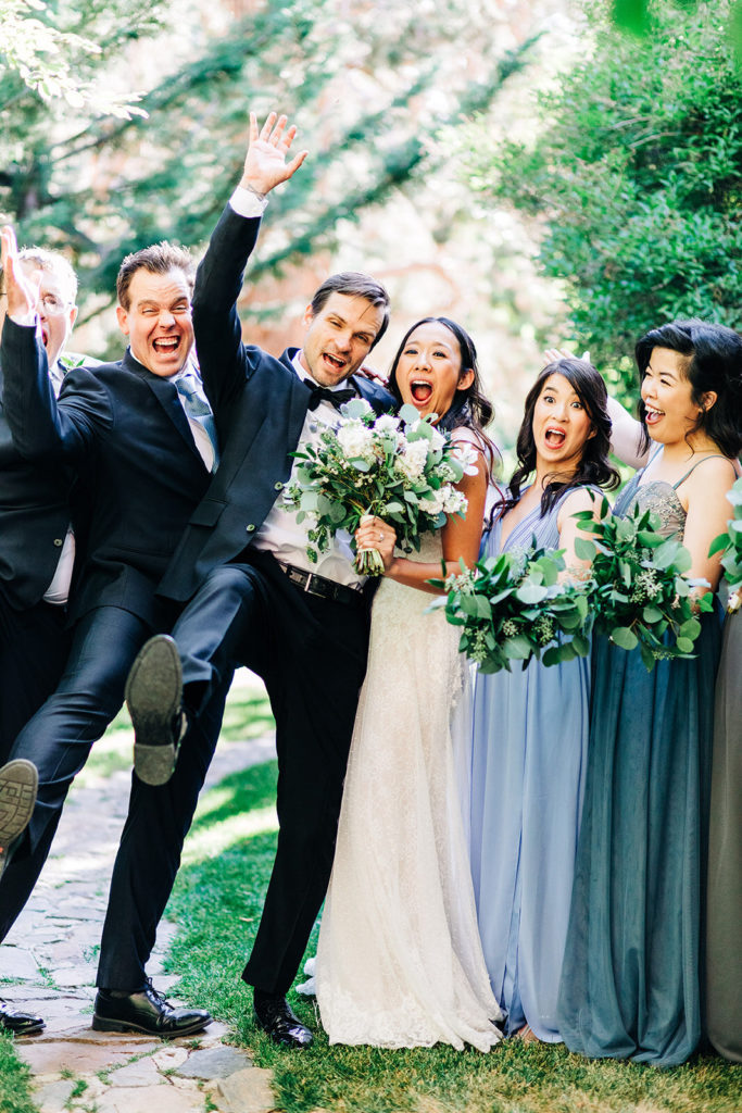 The Gold Mountain Manor In Big Bear, CA wedding photography; bride and groom with their friends celebrating the joy of wedding
