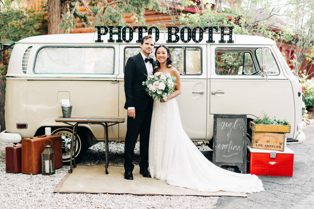 The Gold Mountain Manor In Big Bear, CA wedding photography; bride and groom beautiful photo in front of photo booth van