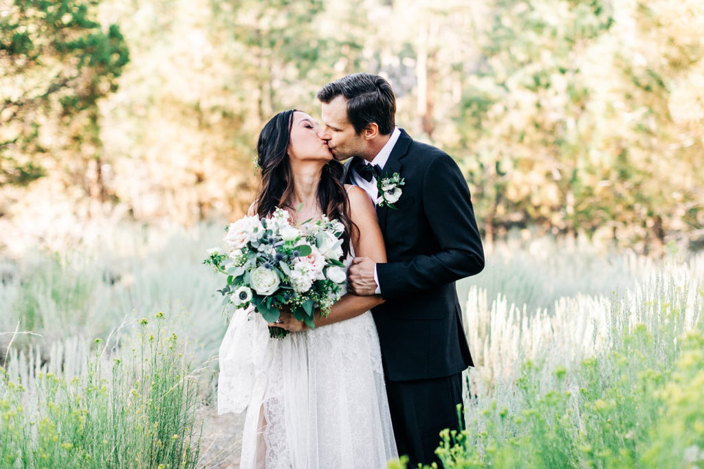 The Gold Mountain Manor In Big Bear, CA wedding photography; bride and groom kissing