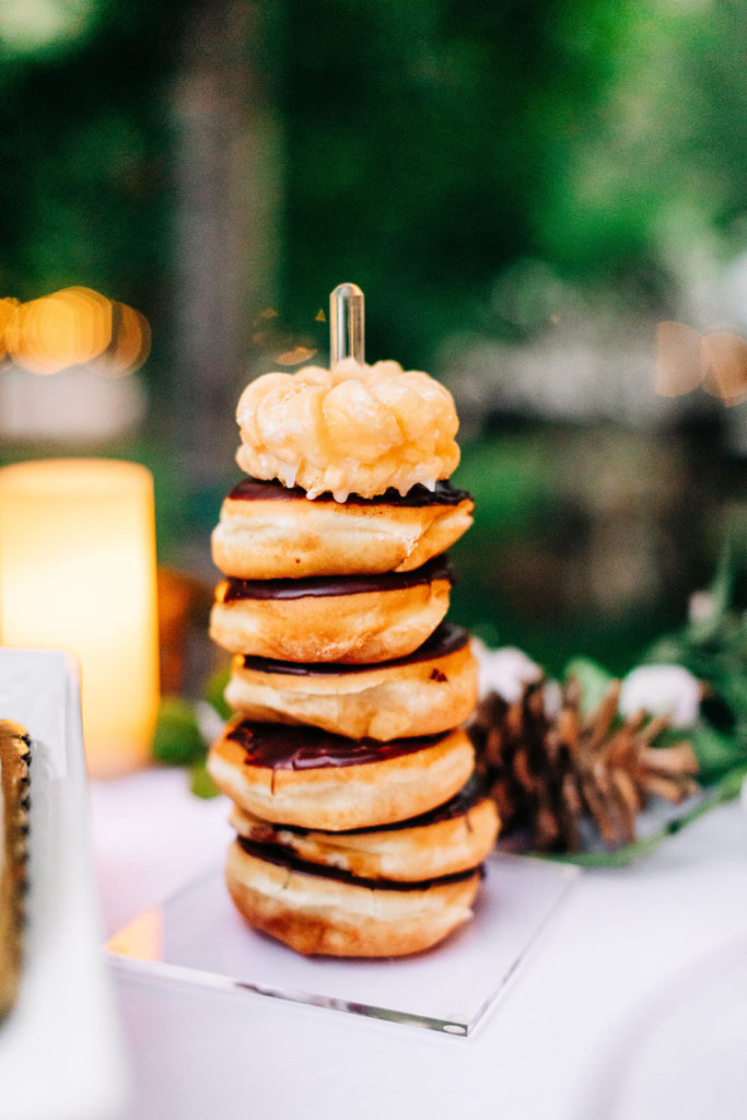 The Gold Mountain Manor In Big Bear, CA wedding photography; delicious donuts vertically placed at the table