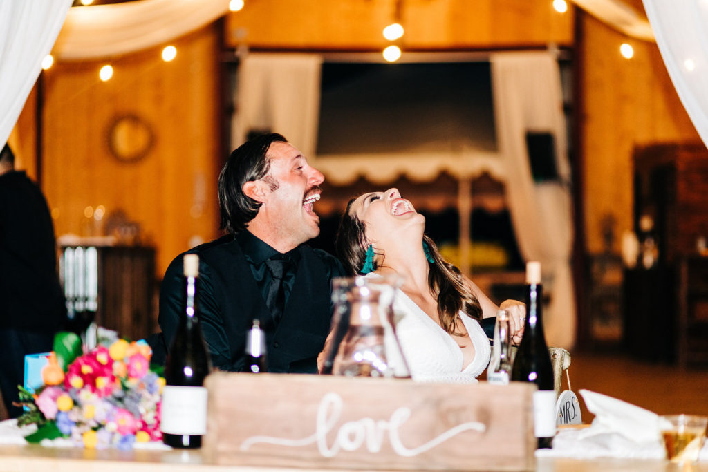 Sweet Pea Ranch In Upland, CA wedding photography; bride and groom laughing