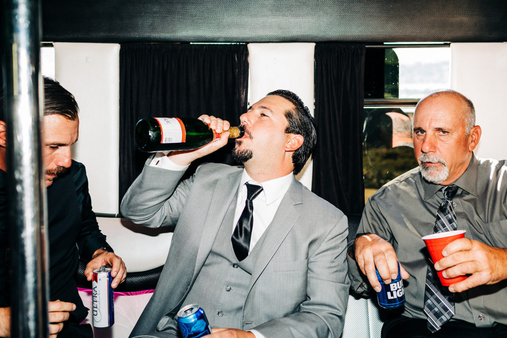 Sweet Pea Ranch In Upland, CA wedding photography; groomsman drinking the champagne