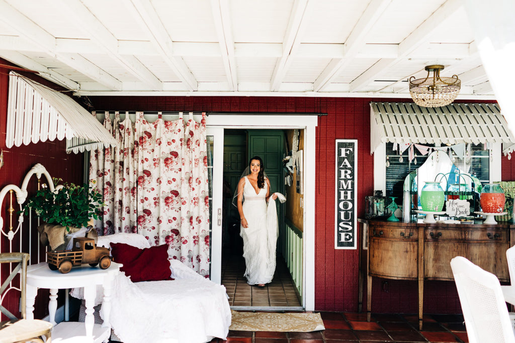 Sweet Pea Ranch In Upland, CA wedding photography; bride coming through the door