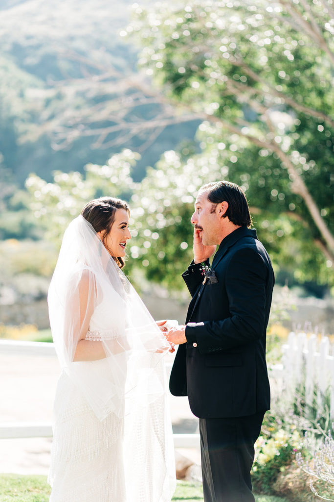 Sweet Pea Ranch In Upland, CA wedding photography; bride and groom looking at each other and smiling