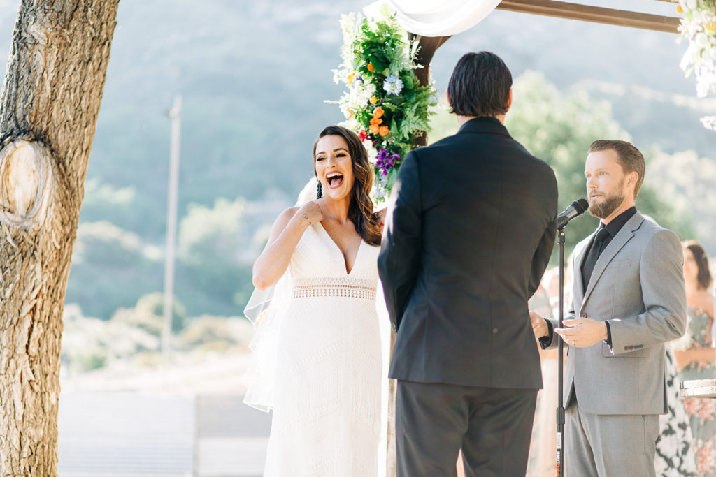 Sweet Pea Ranch In Upland, CA wedding photography; bride and groom listening to the vows
