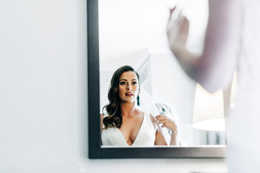 Sweet Pea Ranch In Upland, CA wedding photography; bride looking into the mirror