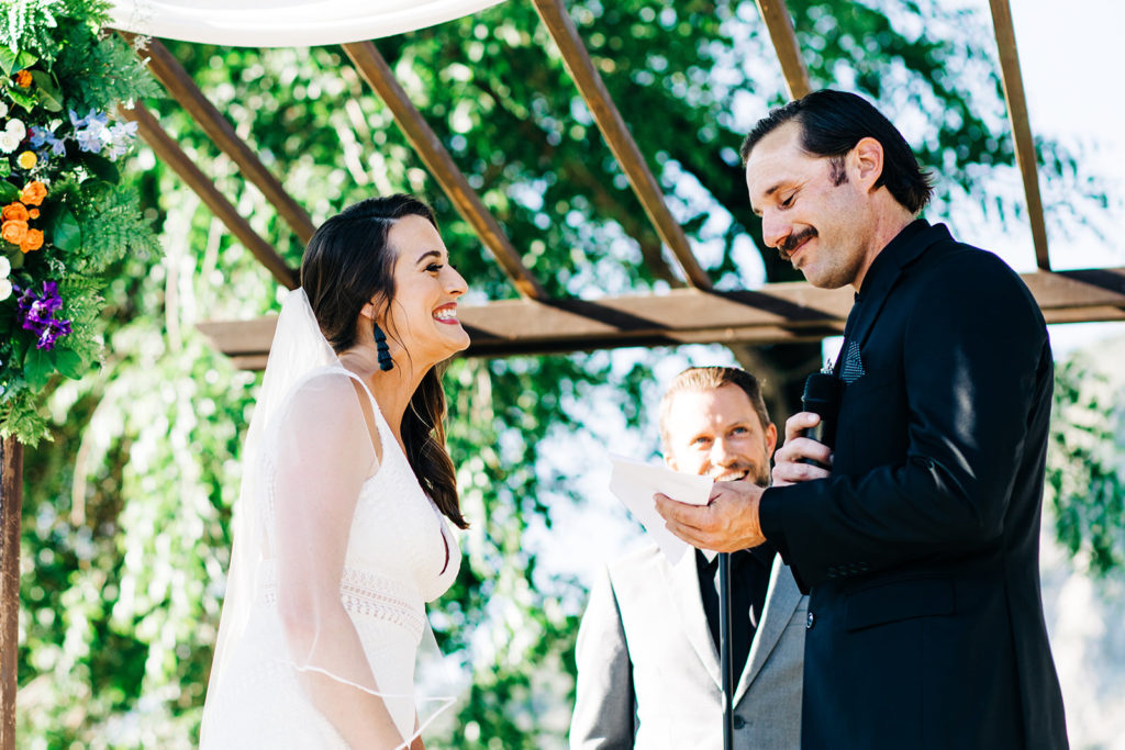 Sweet Pea Ranch In Upland, CA wedding photography; bride listening to the groom's vows