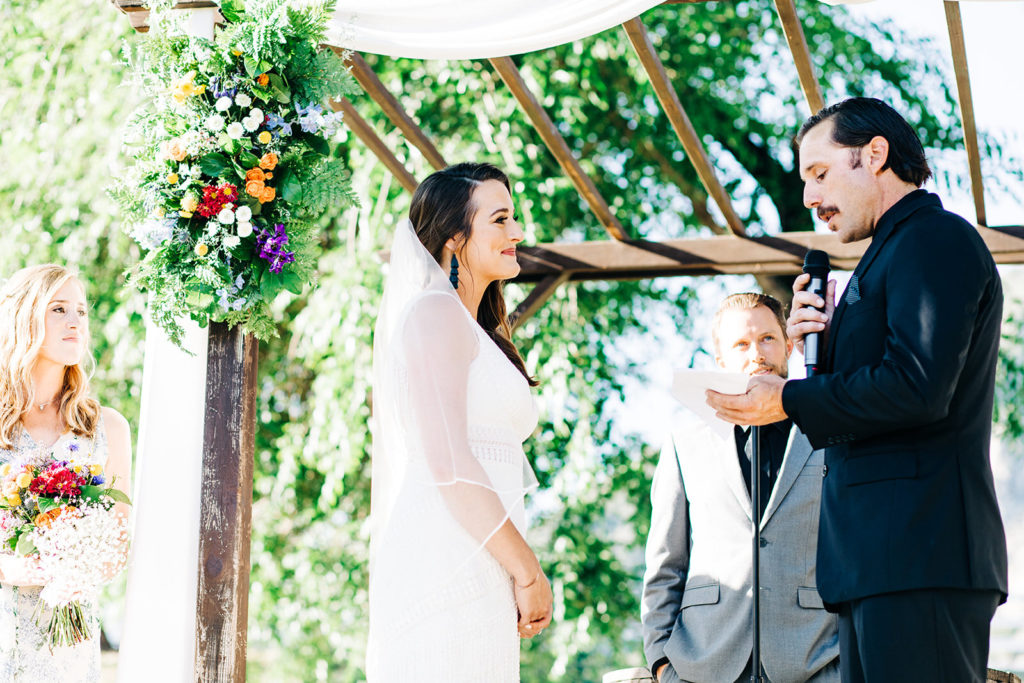Sweet Pea Ranch In Upland, CA wedding photography; groom reading the vows