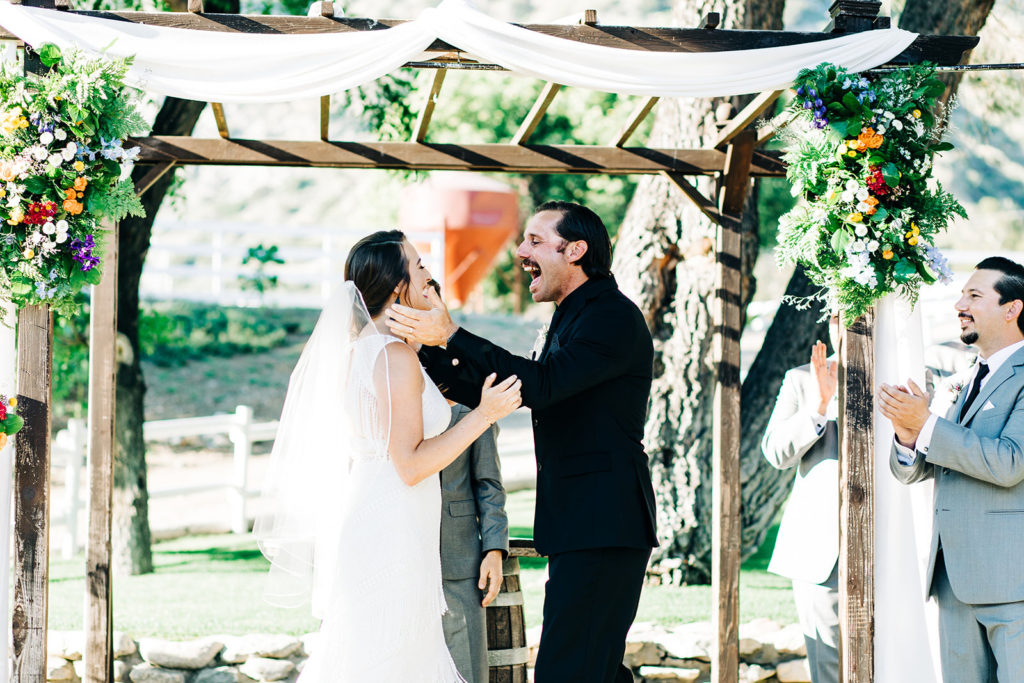 Sweet Pea Ranch In Upland, CA wedding photography; bride and groom about to kiss