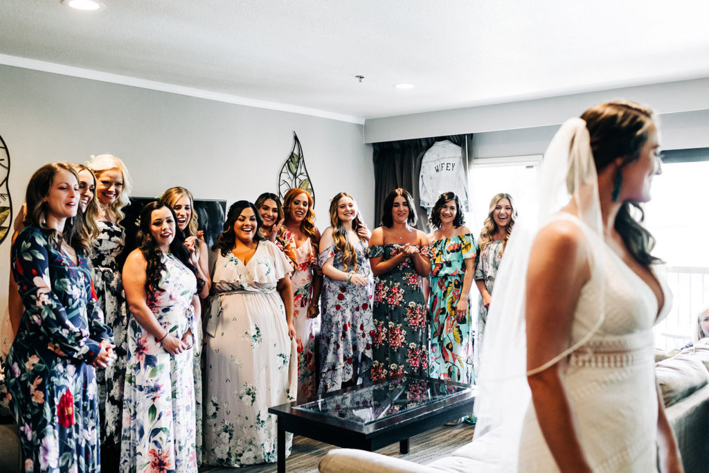 Sweet Pea Ranch In Upland, CA wedding photography; bridesmaids looking at bride