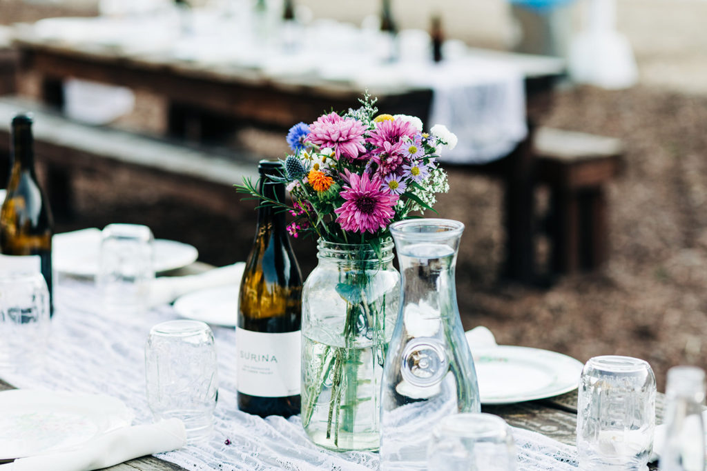 Sweet Pea Ranch In Upland, CA wedding photography; beautiful champagne bottle and flower pot on the table