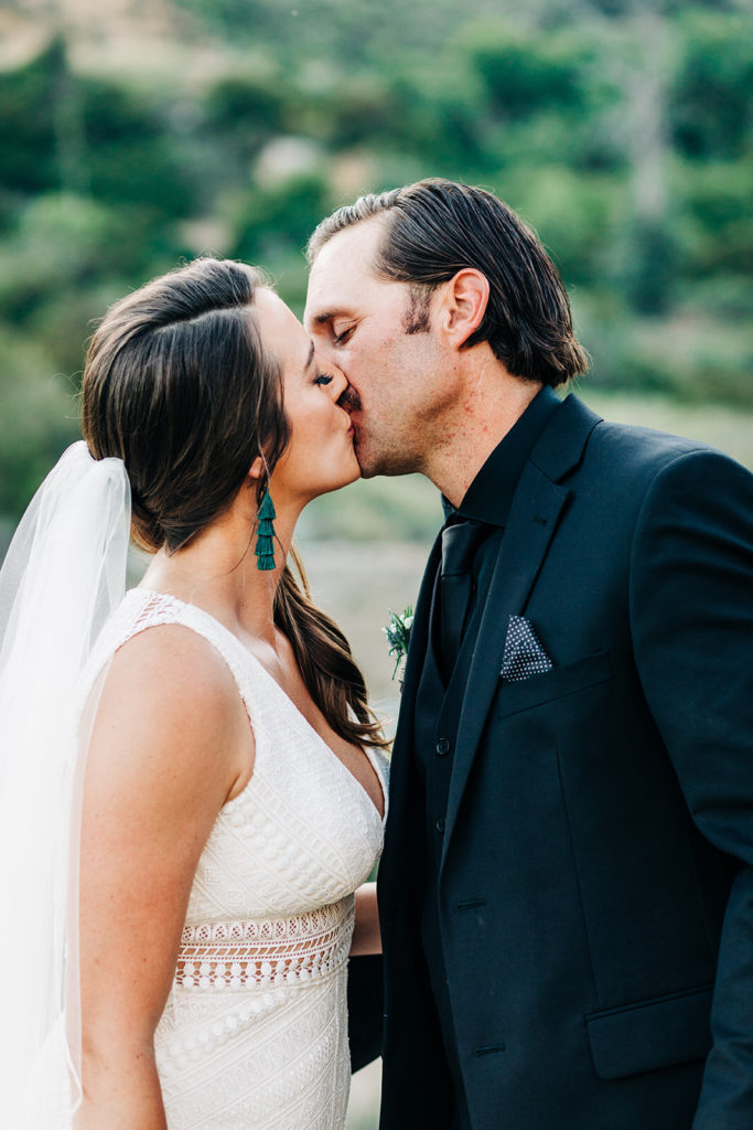 Sweet Pea Ranch In Upland, CA wedding photography; bride and groom kissing