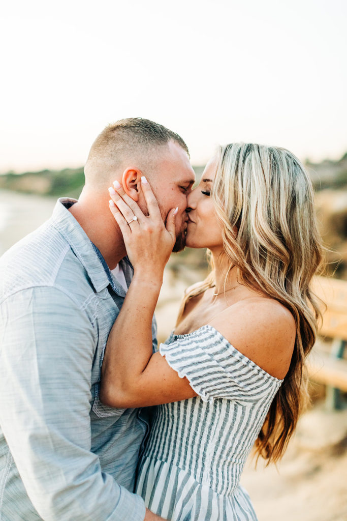 crystal cove beach engagement photos in orange county; couple kissing at the beach