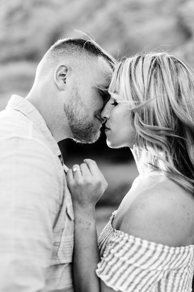 crystal cove beach engagement photos in orange county; black and white photo of couple kissing at the beach