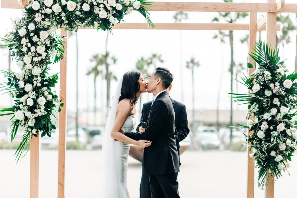 Pasea Hotel & Spa in Huntington Beach, CA wedding photography; bride and groom kissing each other