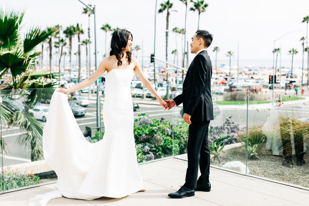 Pasea Hotel & Spa in Huntington Beach, CA wedding photography; lovely picture of bride and groom at the roadside