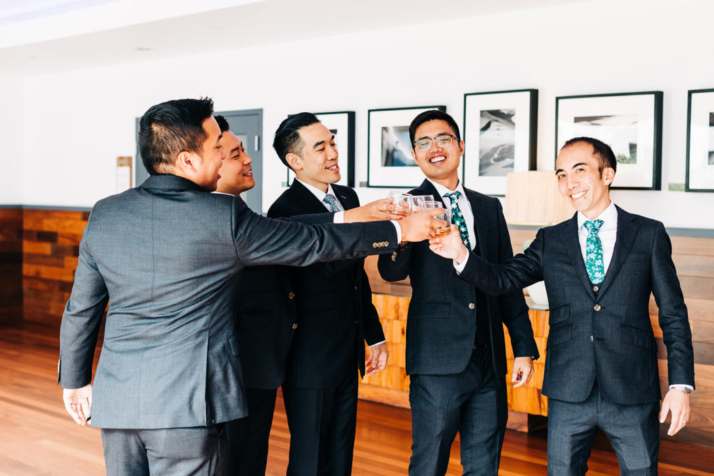 Pasea Hotel & Spa in Huntington Beach, CA wedding photography; groom having a cheers with his friends