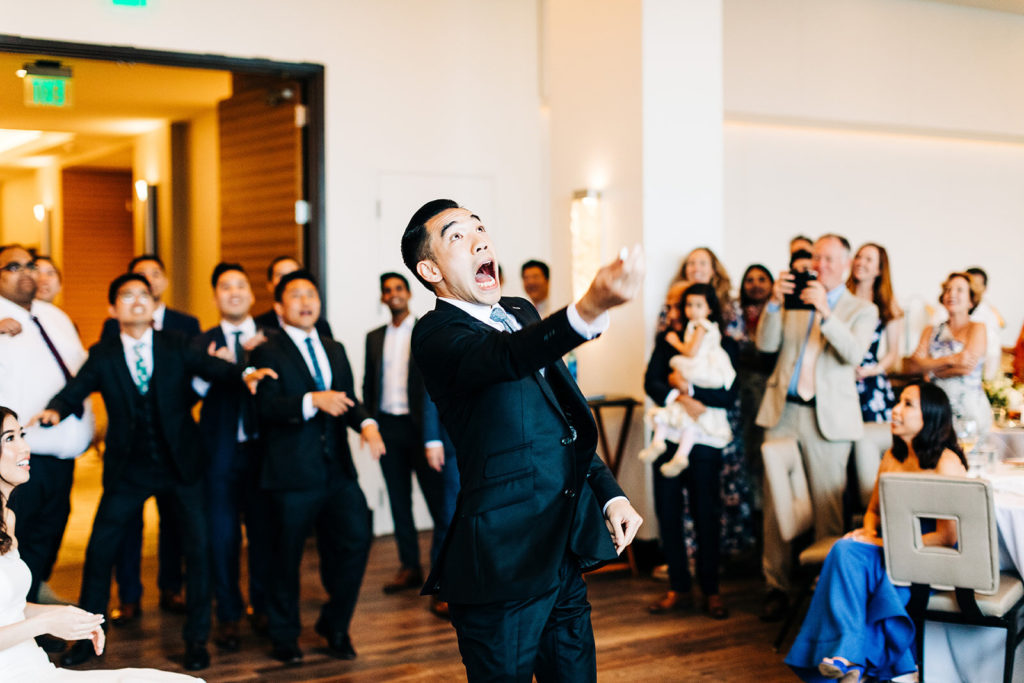Pasea Hotel & Spa in Huntington Beach, CA wedding photography; groom tossing the garter