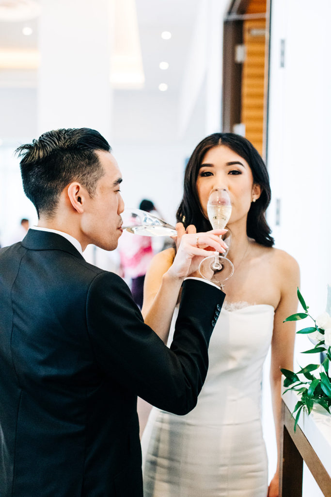 Pasea Hotel & Spa in Huntington Beach, CA wedding photography; bride and groom crossing the elbows with each other and drinking the toast