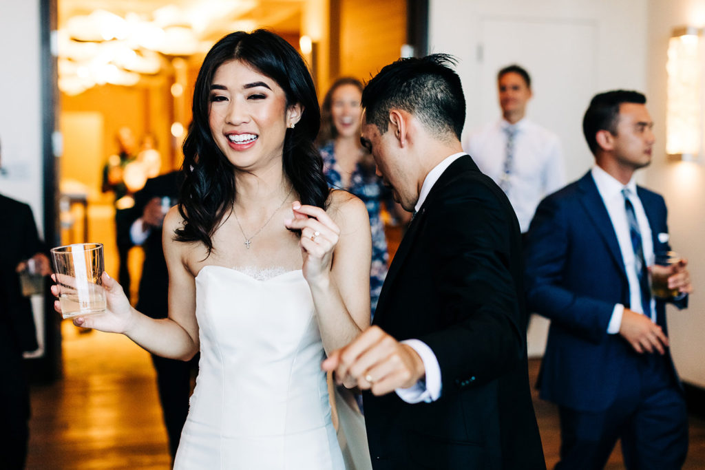 Pasea Hotel & Spa in Huntington Beach, CA wedding photography; bride and groom dancing with toast in hand
