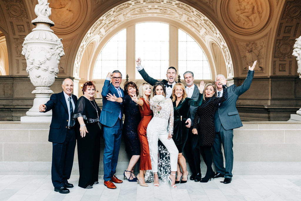 City Hall in San Francisco, CA wedding photography; bride and grooms group photo with family