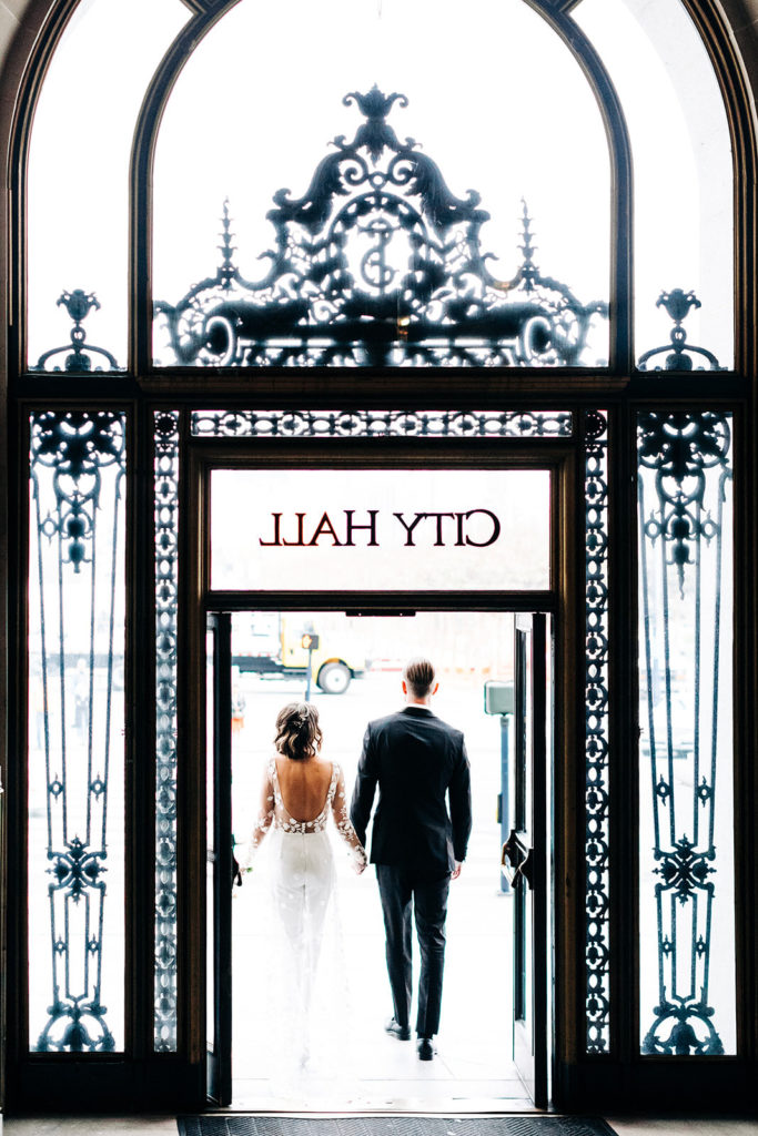 City Hall in San Francisco, CA wedding photography; bride and groom exiting