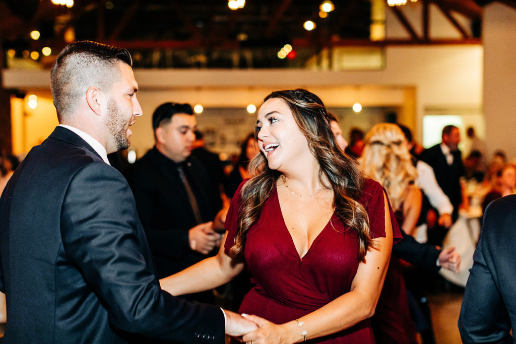 Colony house in Anaheim, CA wedding photography; bridesmaid dancing