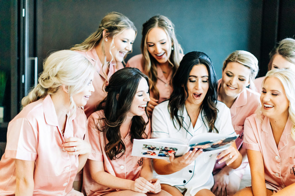 Colony house in Anaheim, CA wedding photography; bride recalling memories with bridemaids