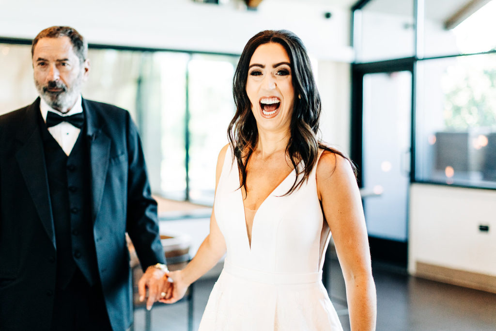 Colony house in Anaheim, CA wedding photography; bride with her father in happy mood
