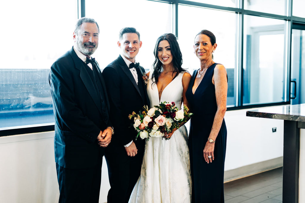 Colony house in Anaheim, CA wedding photography; bride and groom with bride's parents