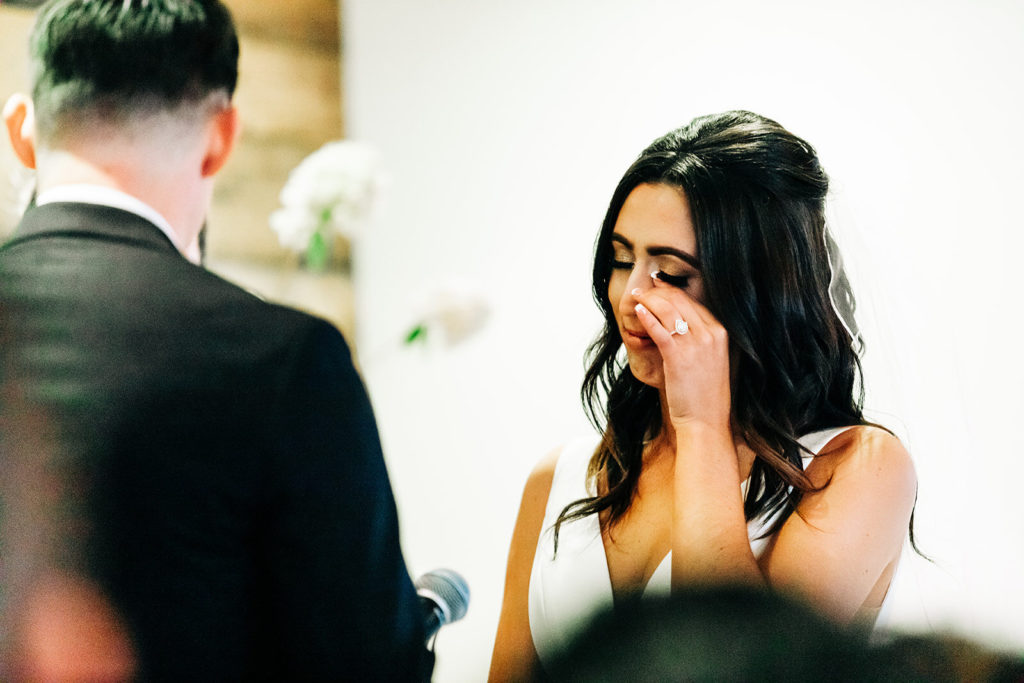 Colony house in Anaheim, CA wedding photography; bride getting emotional and couldn't hold her tears