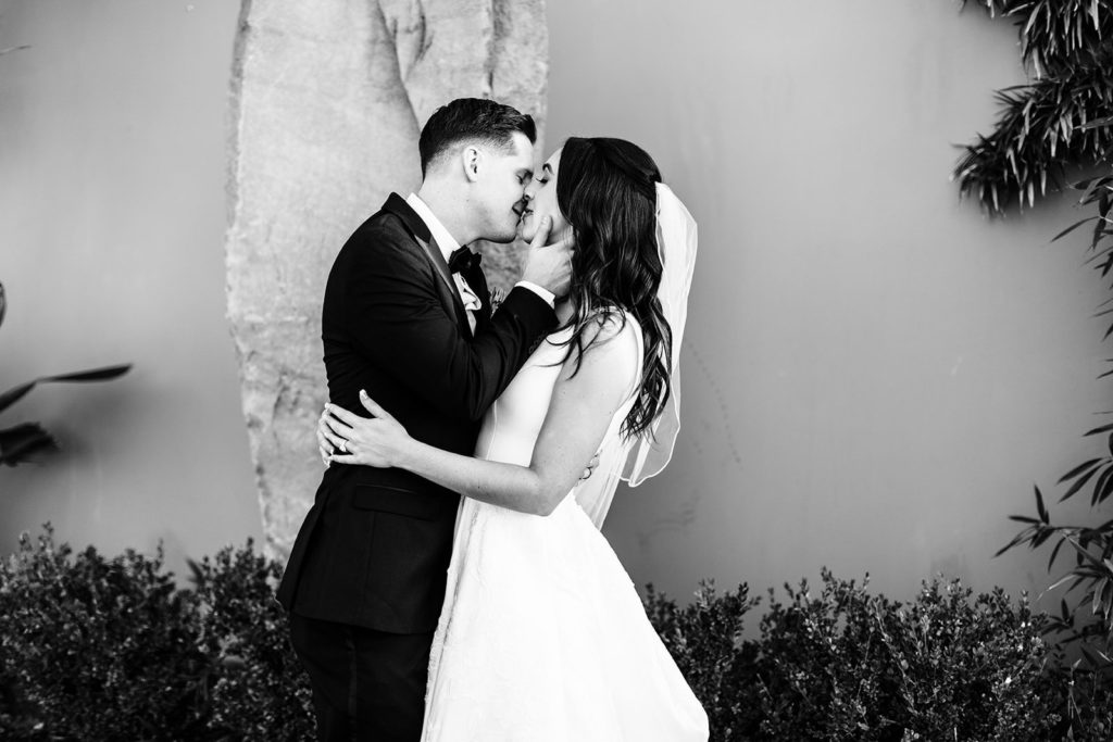 Colony house in Anaheim, CA wedding photography; bride and groom kissing each other