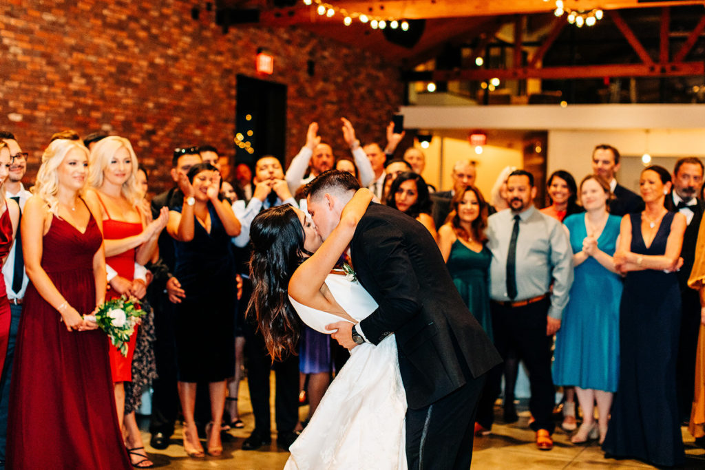 Colony house in Anaheim, CA wedding photography; bride and groom kissing after dance