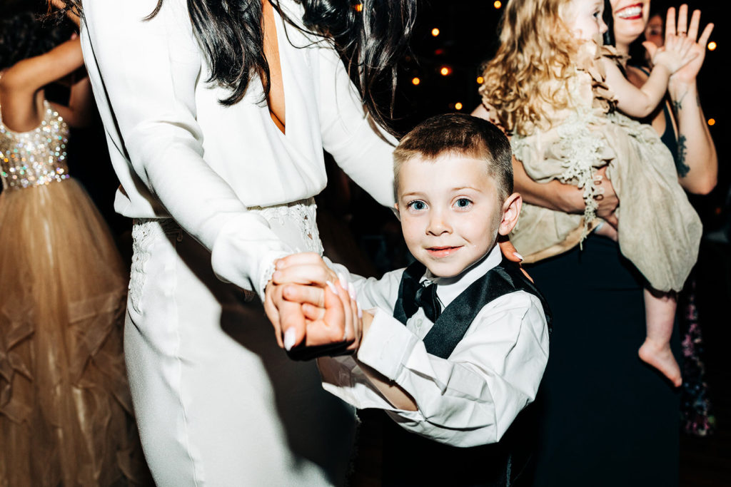 Avalon Legacy Ranch wedding photography; cute little boy dancing