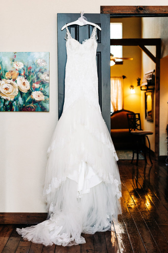 Avalon Legacy Ranch wedding photography; brides wedding dress hanging