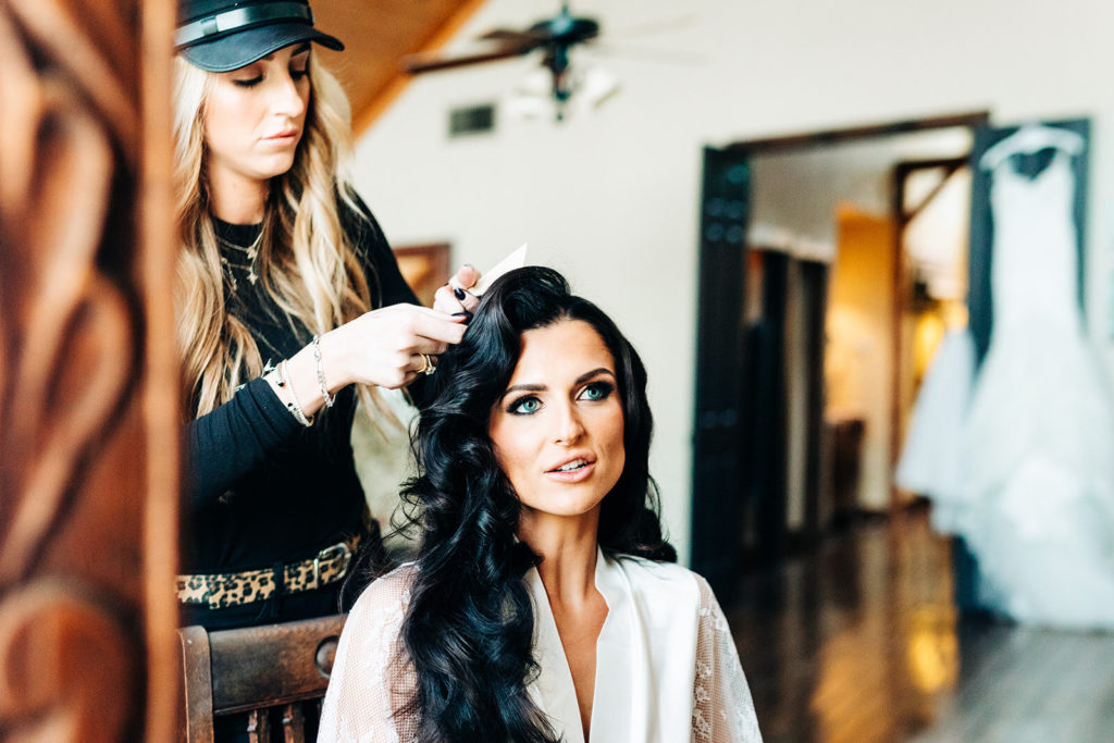 Avalon Legacy Ranch wedding photography; bride getting her hair done on her wedding day
