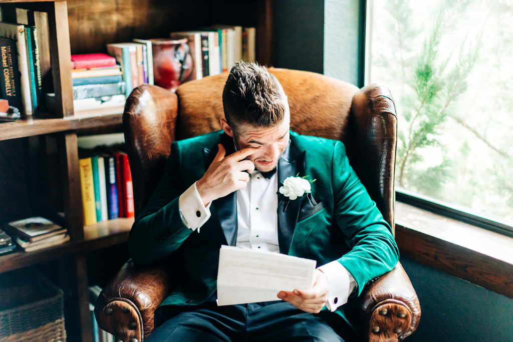 Avalon Legacy Ranch wedding photography; groom getting emotional while reading vows