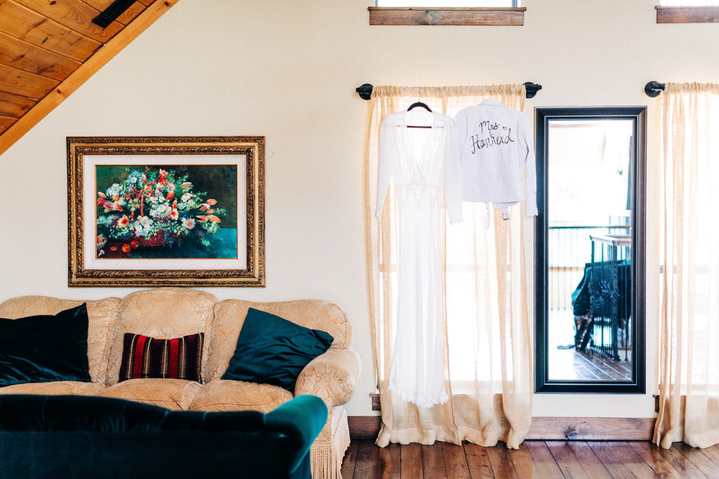 Avalon Legacy Ranch wedding photography; dress and shirt hanging in the living room