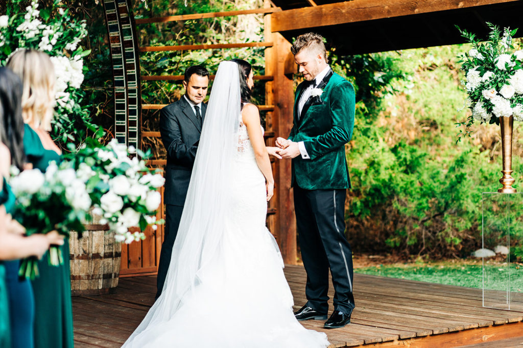 Avalon Legacy Ranch wedding photography; groom placing the ring