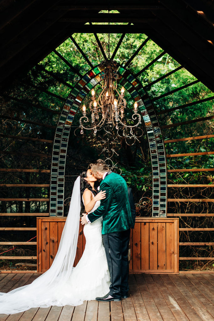 Avalon Legacy Ranch wedding photography; bride & groom kissing