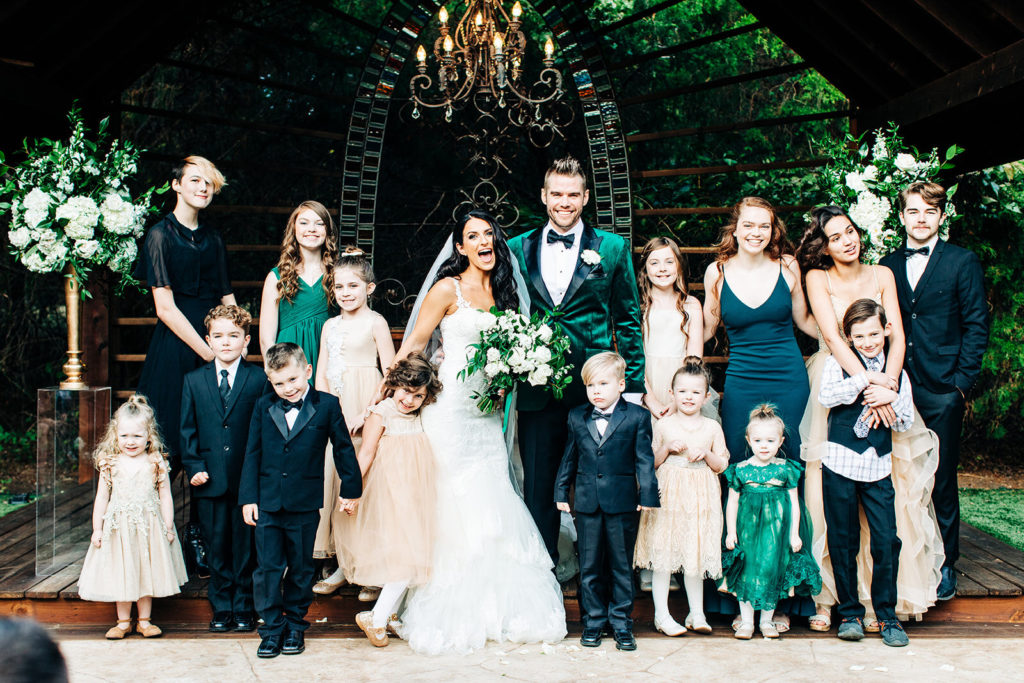 Avalon Legacy Ranch wedding photography; bride & groom in a group photo