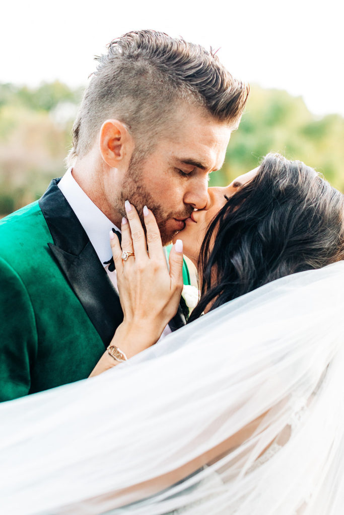 southern california wedding photographer; bride kissing her groom