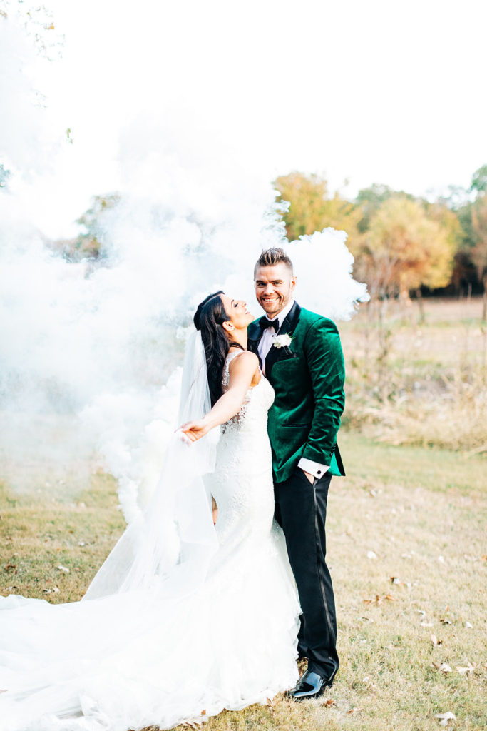 Avalon Legacy Ranch wedding photography; bride & groom with smoke in the background