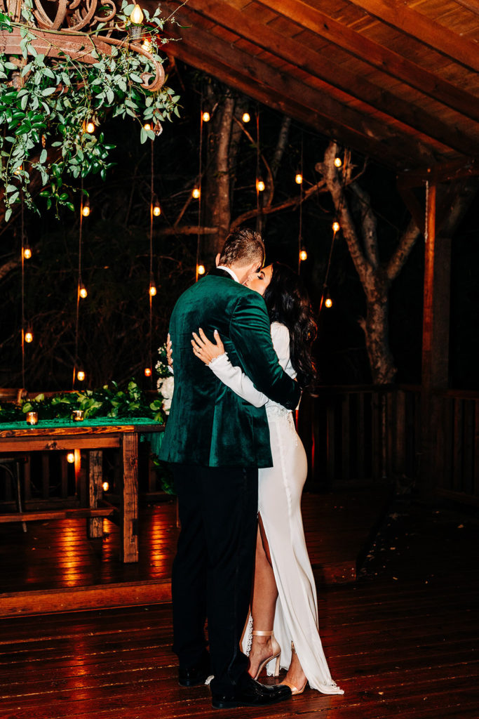 Avalon Legacy Ranch wedding photography; bride and groom hugging with beautiful beautiful background of trees with lighting