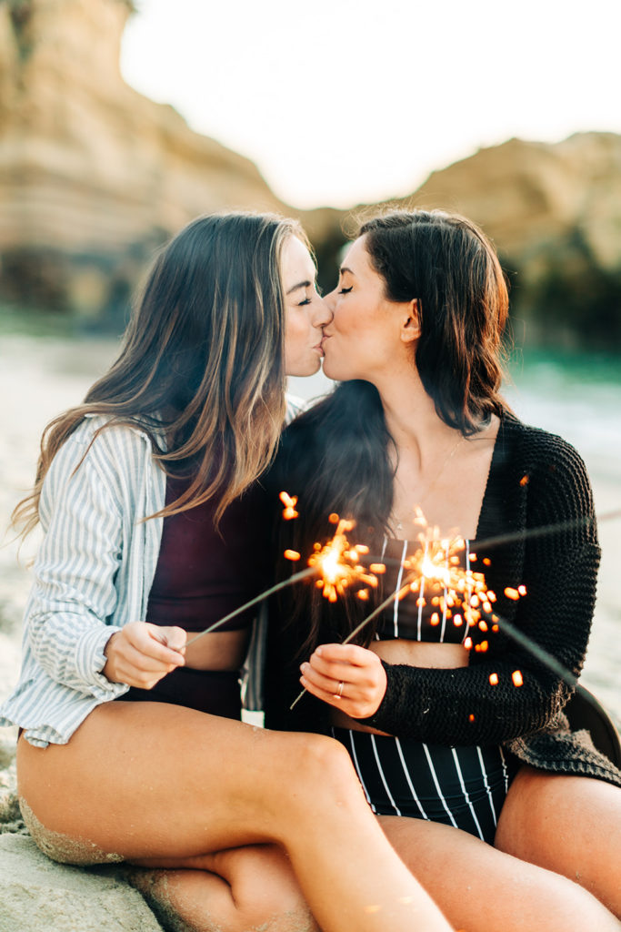 laguna beach engagement photos; lesbian couple with sparklers at the beach in laguna beach, ca