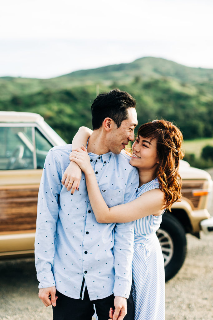 southern california engagement photos; man kissing woman's forehead