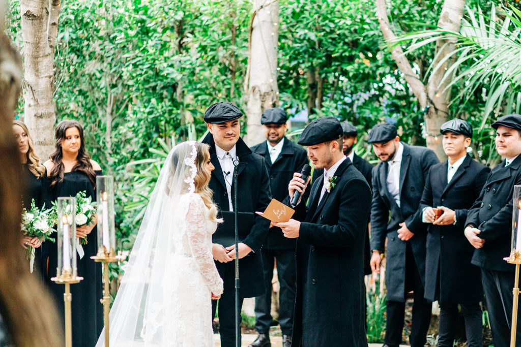 Hartley Botanica wedding photography; groom reading vows to bride during wedding ceremony