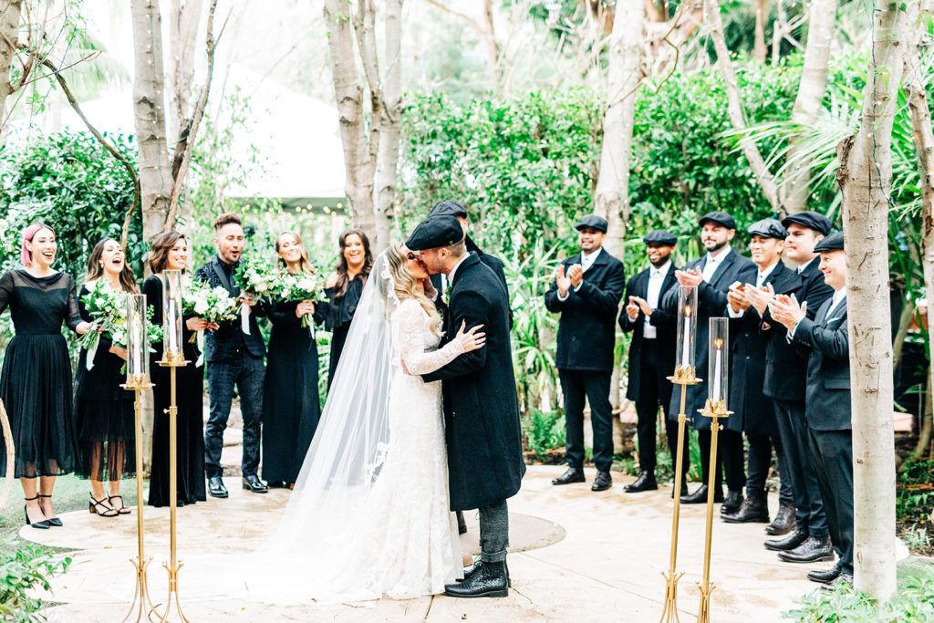 Hartley Botanica wedding photography; outdoor wedding ceremony with bride and groom kissing